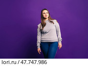 Plus size model in casual clothes, fat woman on purple background. Стоковое фото, фотограф Станислав Тарко / Фотобанк Лори