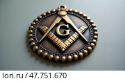 Ornate bronze masonic emblem with letter g. Стоковое AI-изображение, AI-художник Андрей Бакусов / Фотобанк Лори