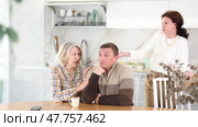 Family quarrel, old woman calming man, all are upset and dissatisfied. Family quarrel, old woman calming man. Стоковое видео, видеограф Яков Филимонов / Фотобанк Лори