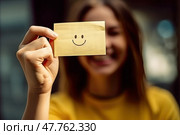 With boundless enthusiasm, a lively girl proudly presents a sunny piece of paper with a beaming smile drawn on it. Стоковое AI-изображение, AI-художник Данила Большаков / Фотобанк Лори