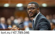 A young man in a suit delivers a compelling speech at a formal gathering, engaging an audience with his confident demeanor in a well-lit room. Стоковое AI-изображение, AI-художник Данила Большаков / Фотобанк Лори