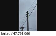 Power line pole with wires hanging from it. Стоковое видео, видеограф Надежда Кап / Фотобанк Лори