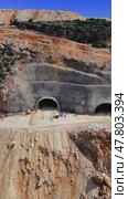 Construction workers and engineers are building a new tunnel through a mountain range in turkey, using heavy machinery and specialized equipment. Стоковое видео, видеограф ILIA GOROKHOV / Фотобанк Лори