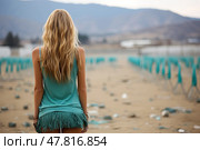 Stunning woman is standing amidst field scattered with discarded plastic bottles. Image depicts environmental impact of plastic pollution on our landscapes. Стоковое AI-изображение, AI-художник Данила Большаков / Фотобанк Лори