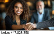 A young woman is smiling and shaking hands confidently with a colleague in a contemporary office environment while others look on. Стоковое AI-изображение, AI-художник Данила Большаков / Фотобанк Лори