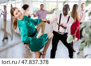 Man and woman practicing swing dance in dancing studio. Стоковое фото, фотограф Яков Филимонов / Фотобанк Лори