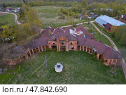 Aerial view of the old building of the stables of Count Stroganov's stud farm on a May day. Volyshevo. Pskov region, Russia (2022 год). Стоковое фото, фотограф Виктор Карасев / Фотобанк Лори