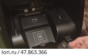 Russia, Sosnovy Bor, April 18, 2025 - Customer using contactless payment at atm. Редакционное видео, видеограф Андрей Знаменский / Фотобанк Лори
