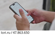 Man using ChatGPT in the mobile phone. This app is a chatbot based on Artificial Intelligence developed by OpenAI. Dubai, UAE: 07.05.2025. High quality. Стоковое видео, видеограф Feruza Tashmetova / Фотобанк Лори