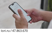 Man using ChatGPT in the mobile phone. This app is a chatbot based on Artificial Intelligence developed by OpenAI. Dubai, UAE: 07.05.2025. High quality. Стоковое видео, видеограф Feruza Tashmetova / Фотобанк Лори