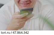 Man using ChatGPT in the mobile phone. This app is a chatbot based on Artificial Intelligence developed by OpenAI. Dubai, UAE: 07.05.2025. High quality. Стоковое видео, видеограф Feruza Tashmetova / Фотобанк Лори