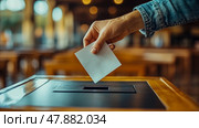 Voter casts a ballot into an election box located in a crowded public area during evening hours, emphasizing civic engagement and participation. Стоковое AI-изображение, AI-художник Данила Большаков / Фотобанк Лори
