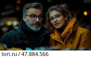 A man and woman share a light-hearted moment at an outdoor market, surrounded by autumn decor and warm clothing, under a cozy atmosphere. Стоковое AI-изображение, AI-художник Данила Большаков / Фотобанк Лори