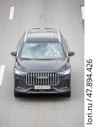 Jaecoo J8 car driving in city with motion blur, front view from above. Редакционное фото, фотограф Константин Григорьев / Фотобанк Лори