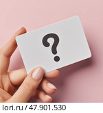 Hand holding a question card with a minimalist design on a pink background. Рука, держащая карточку с вопросом, с минималистичным дизайном на розовом фоне. Стоковое AI-изображение, AI-художник Katsiaryna Repich / Фотобанк Лори