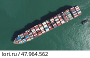 Cargo ship filled with containers in port area. Стоковое видео, видеограф Михаил Коханчиков / Фотобанк Лори