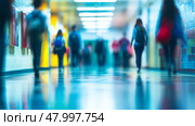 A somewhat blurry hospital corridor filled with numerous people walking about on their various errands and duties. Стоковое AI-изображение, AI-художник Anastasy Yarmolovich / Фотобанк Лори
