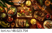 A colorful array of food and beverages is arranged on a wooden table in a summery outdoor atmosphere. Стоковое AI-изображение, AI-художник Данила Большаков / Фотобанк Лори