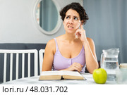 Woman is hysterical about not being able to learn her lessons for exams. Стоковое фото, фотограф Яков Филимонов / Фотобанк Лори
