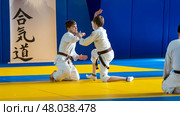 Moscow, Russia, April 24, 2025: Children practice martial arts with a coach in the gym, sambo, judo, aikido. Редакционное фото, фотограф Igor Skripachev / Фотобанк Лори