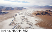 bleak cold desert landscape ai generated. Стоковое AI-изображение, AI-художник Vectorwin / Фотобанк Лори