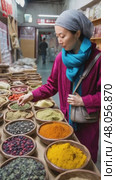 Woman choosing spices at the market. Стоковое AI-видео, аниматор Юрий Поздников / Фотобанк Лори