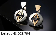 earrings gold and silver jewelry ai generated. Стоковое AI-изображение, AI-художник Vectorwin / Фотобанк Лори