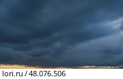Brooding, dramatic storm clouds gather, hinting at an approaching tempest, perfect for conveying feelings of mystery, tension, or the raw power of nature, time lapse. Стоковое видео, видеограф Андрей Журавлев / Фотобанк Лори