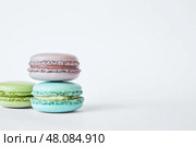 Three colorful French Macarons, stacked in pyramid. macaroons cakes. Стоковое фото, фотограф Екатерина Якименко / Фотобанк Лори
