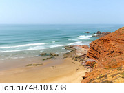 Picturesque red cliffs on shores of the Atlantic Ocean. Morocco. Стоковое фото, фотограф Евгений Ткачёв / Фотобанк Лори