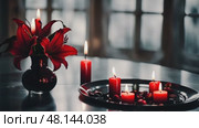 A melancholic indoor setting with a black table adorned with red lilies and candles, casting soft shadows to enhance the mood of sorrow and reflection. Стоковое AI-видео, аниматор Ирина Старикова / Фотобанк Лори