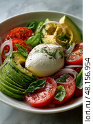 Fresh Salad With Creamy Mozzarella, Ripe Tomatoes, and Avocados Served in a Bowl. Стоковое AI-изображение, AI-художник Юлия Гапеенко / Фотобанк Лори