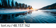 The tranquil river, adorned with drifting ice, reflects the warm hues of dawn. Lush trees line the banks as mist rises, signaling the arrival of spring and the end of winter grasp Generative AI. Стоковое AI-изображение, AI-художник Юлия Петровская / Фотобанк Лори