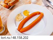 Pair of vienna sausages with horseradish and mustard. Стоковое фото, фотограф Яков Филимонов / Фотобанк Лори