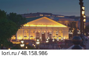 Moscow, RUSSIA - Aug 04 2021, 4k: Panoramic night view on Moscow Manege from Manezhnaya Square, on Aug 04, 2021 in Moscow, Russia. Редакционное видео, видеограф Сергей Богомяко / Фотобанк Лори