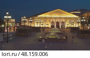 Moscow, RUSSIA - Aug 04 2021, 4k: Panoramic night view on Moscow Manege from Manezhnaya Square, on Aug 04, 2021 in Moscow, Russia. Редакционное видео, видеограф Сергей Богомяко / Фотобанк Лори