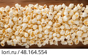 crunchy pop corn background ai generated. Стоковое AI-изображение, AI-художник Vectorwin / Фотобанк Лори