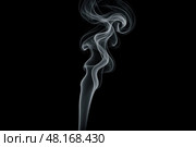 Elegant white smoke trail rising on black background graceful swirling vapor stream abstract mystical atmosphere incense aromatherapy concept. Стоковое фото, фотограф Павел Муравьев / Фотобанк Лори