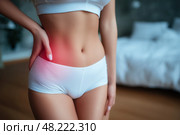 Inflammation of appendicitis, menstrual pain, woman with stomachache suffering from pms at home, endometriosis, cystitis and other diseases of the urinary system. Стоковое AI-изображение, AI-художник Станислав Тарко / Фотобанк Лори