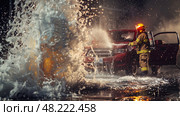 Firefighter Combats Flames From Red Vehicle During Intense Fire Suppression Effort. Стоковое AI-изображение, AI-художник Данила Большаков / Фотобанк Лори
