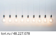 enenment light bulb on white ai generated. Стоковое AI-изображение, AI-художник Vectorwin / Фотобанк Лори