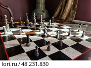 Vintage chess board with checkers, pawns, knights, rooks, bishops, queen and king. Стоковое фото, фотограф Есич Елена / Фотобанк Лори