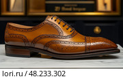 A finely crafted tan brogue shoe is showcased on a polished marble surface, illustrating elegant design elements and superior craftsmanship. Стоковое AI-изображение, AI-художник Данила Большаков / Фотобанк Лори