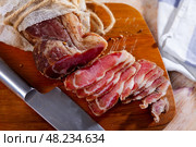 Thinly sliced cured pork sirloin meat. Стоковое фото, фотограф Яков Филимонов / Фотобанк Лори