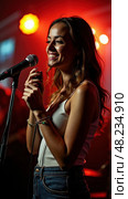 Woman Joyfully Sings Karaoke at a Lively Club, Smiling at the Camera. A Celebration of Entertainment and Music! Стоковое AI-изображение, AI-художник Sergey Grishin / Фотобанк Лори