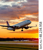 Airplane against the backdrop of the setting sun. Night flight. Стоковое AI-изображение, AI-художник Сергей Елизарьев / Фотобанк Лори