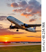 Airplane against the backdrop of the setting sun. Night flight. Стоковое AI-изображение, AI-художник Сергей Елизарьев / Фотобанк Лори