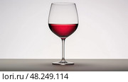 wine glass half empty ai generated. Стоковое AI-изображение, AI-художник Vectorwin / Фотобанк Лори