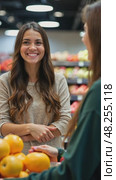 A customer smiling at cashier during checkout, grocery items arranged on conveyor belt, soft overhead lighting creating comfortable atmosphere. Стоковое AI-видео, аниматор Sergey Grishin / Фотобанк Лори