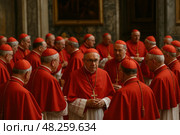 Conclave. Group of mature caucasian catholic cardinals in red robes engaging in conversation. Стоковое AI-изображение, AI-художник Башкирова Анна / Фотобанк Лори